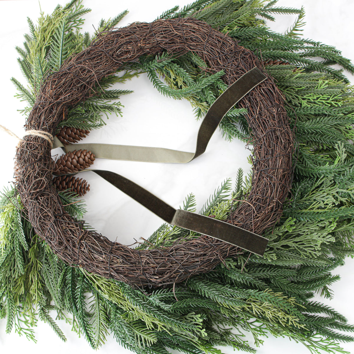 Heart Shaped Pine Wreath with Pinecone Accents and Hunter Green Ribbon