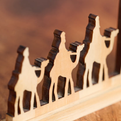 Pine Wood Nativity Cut from a Single Piece with a Praying Family and Wise Men on Camels