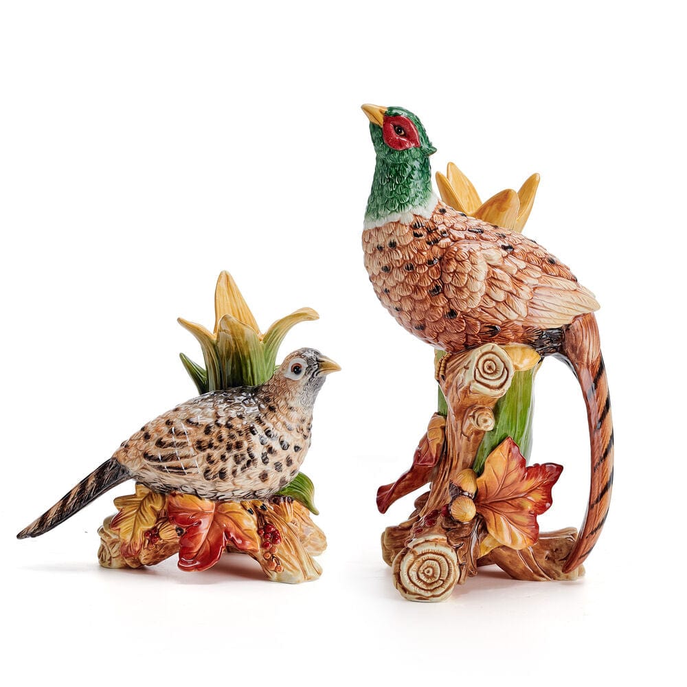 Two pheasant candleholders, a tall standing bird and a smaller perched bird, with leaf and wheat accents