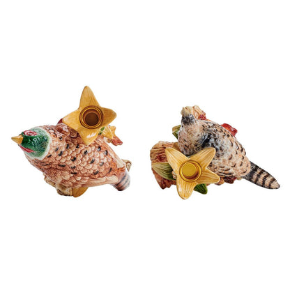 Top view of two pheasant candleholders showing the star shaped candle cups