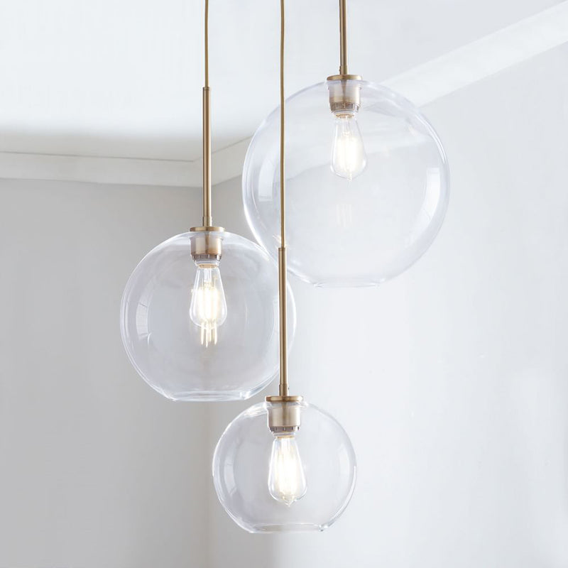 Modern Glass Globe Pendant Light in Brass Design