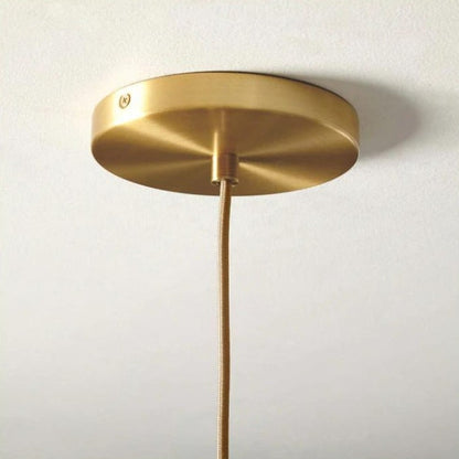 Modern Glass Globe Pendant Light in Brass Design