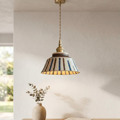 Textured Ceramic Pendant Light with Brass Details and Warm Lighting