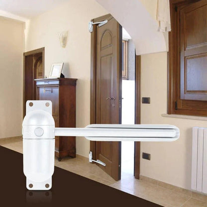 Interior Door Closer with Spring-Loaded Arm and Cushioned Closing Action