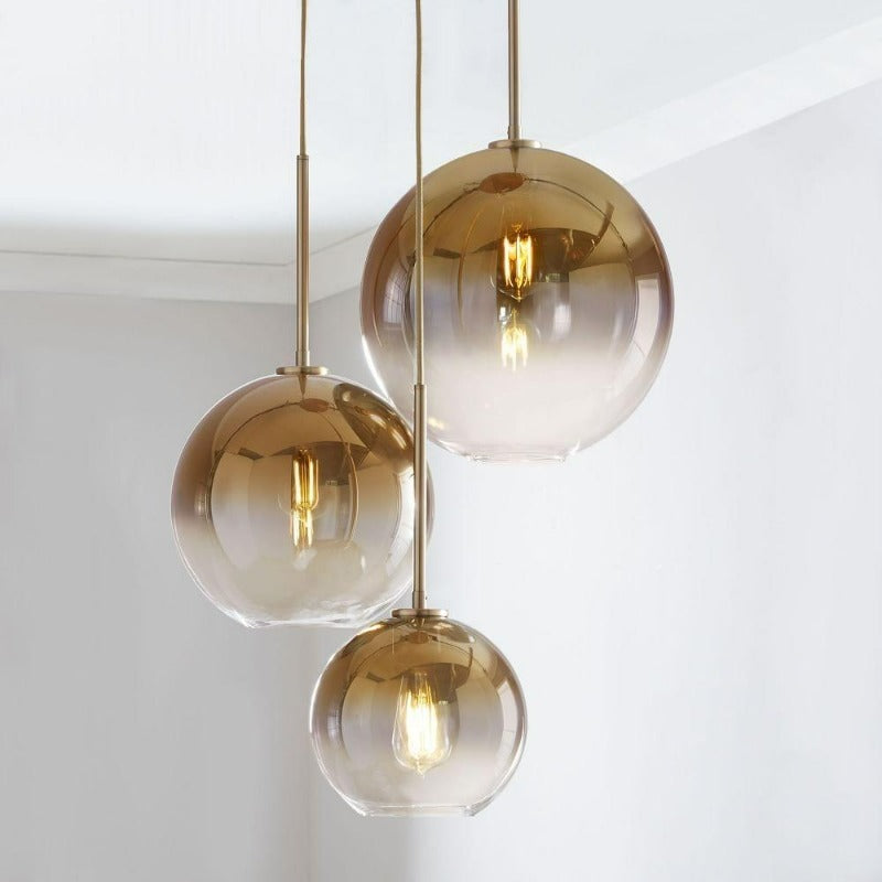Modern Glass Globe Pendant Light in Brass Design