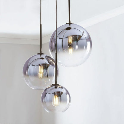 Modern Glass Globe Pendant Light in Brass Design