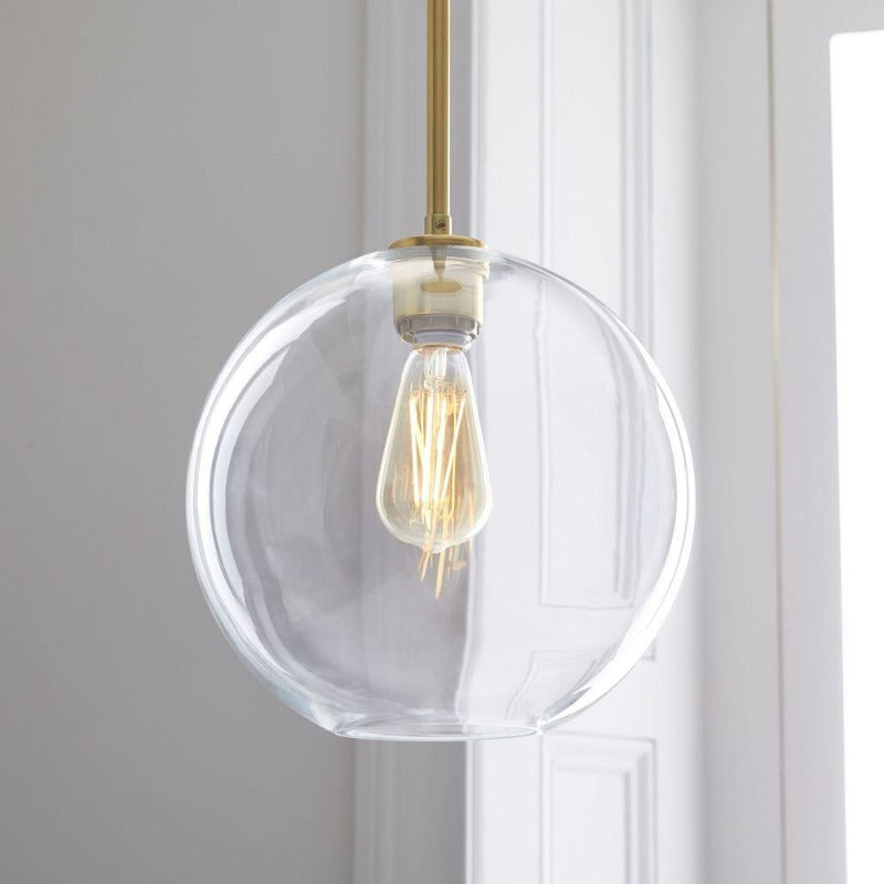 Modern Glass Globe Pendant Light in Brass Design